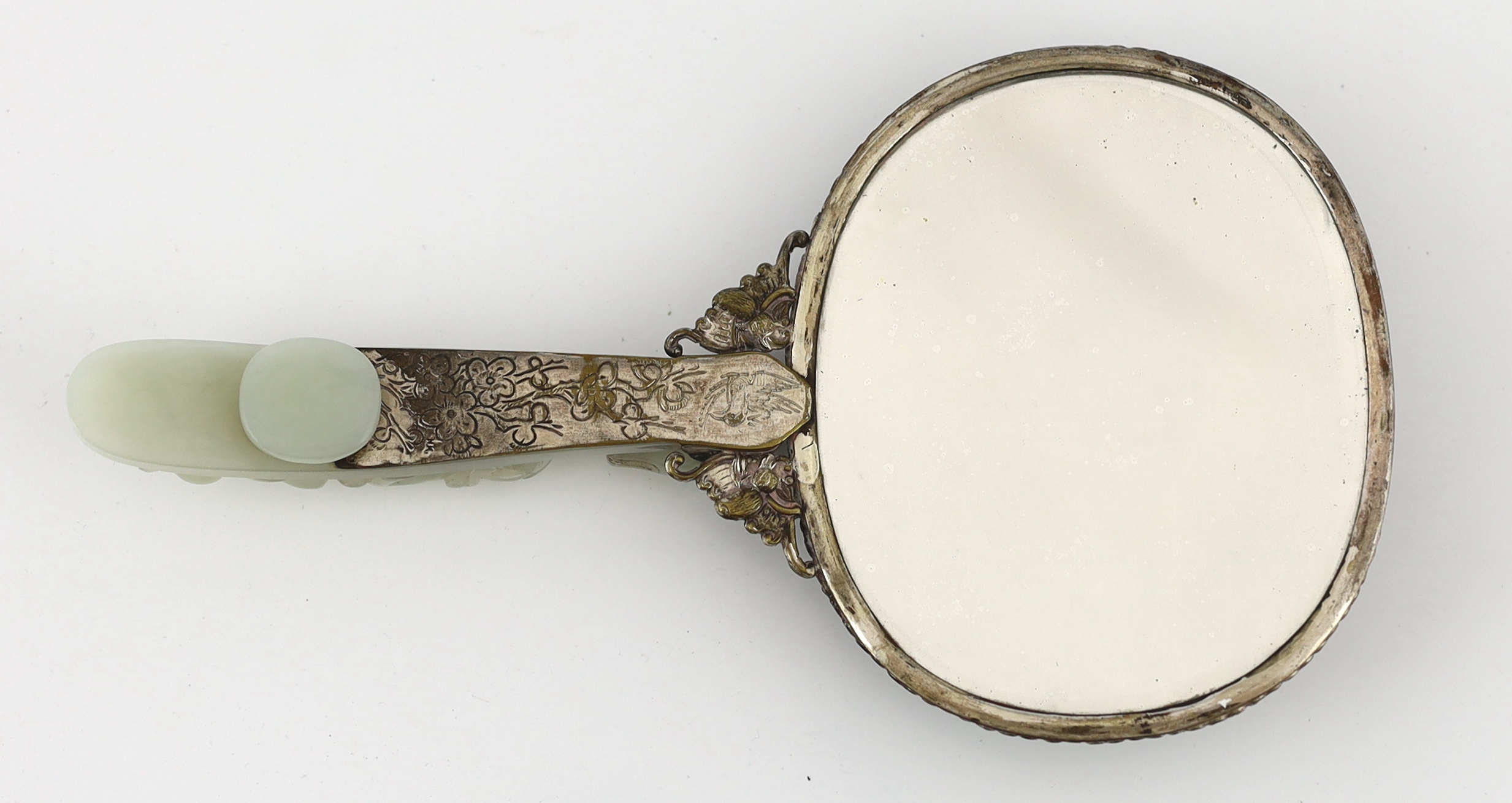 A Chinese celadon jade mounted hand mirror, the jade 18th/19th century